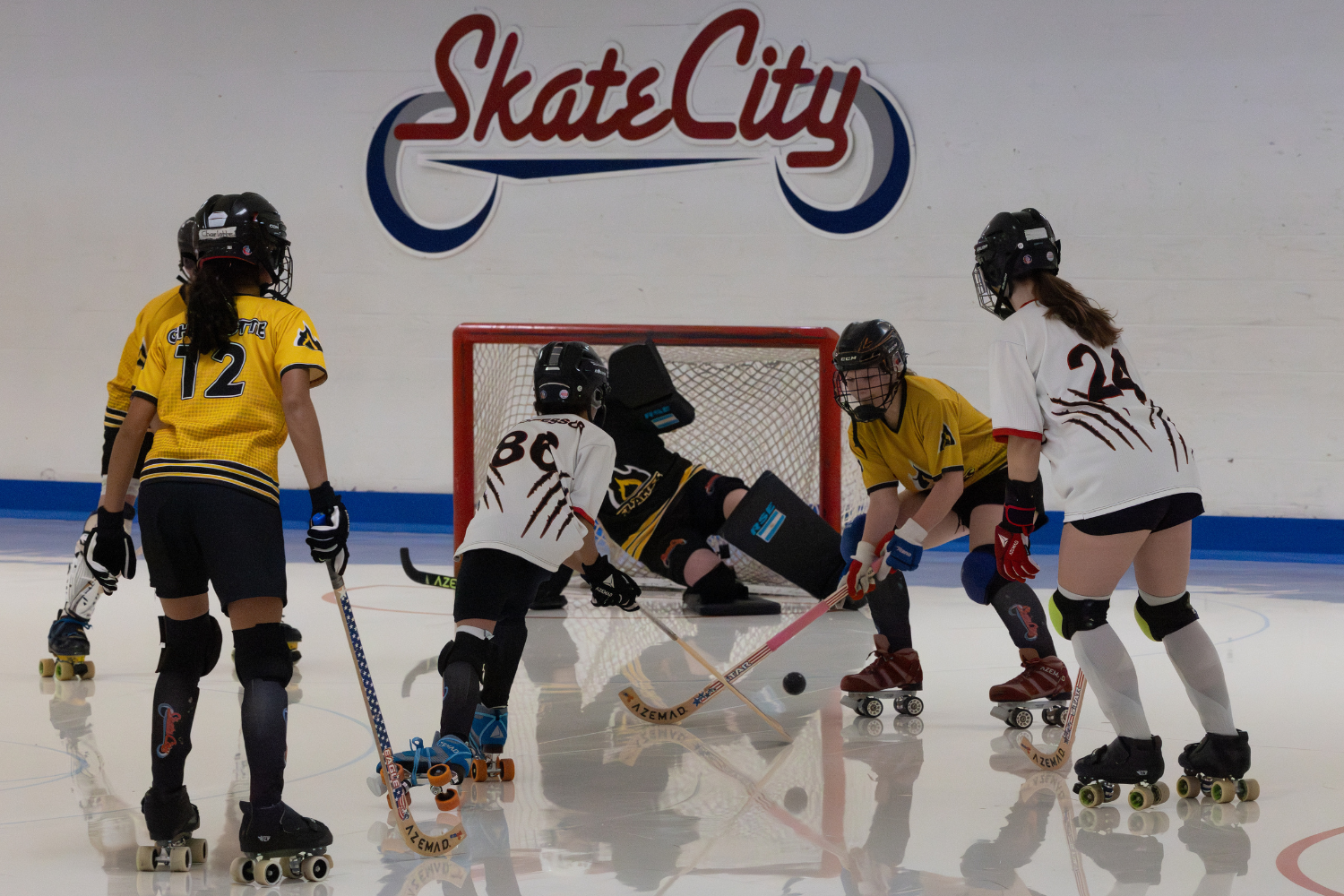 Players competing in a ball hockey league game at Skate City Sports in Colorado